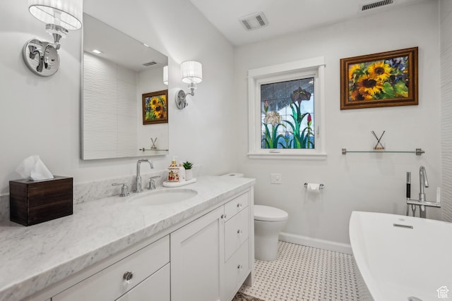 5419 S Kenwood Dr E, Salt Lake City, UT 84107 - bathroom with a freestanding tub, vanity, toilet, tile patterned floors, and baseboards