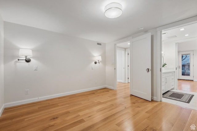 5419 S Kenwood Dr E, Salt Lake City, UT 84107 - spare room featuring light wood-style flooring, baseboards, and a smoke detector