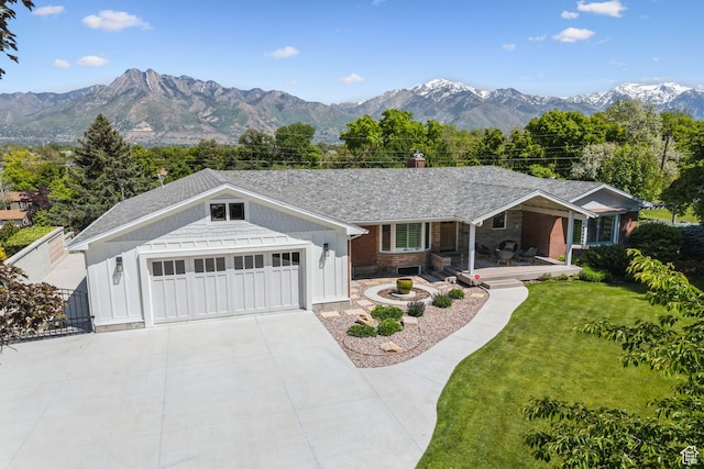 5419 S Kenwood Dr E, Salt Lake City, UT 84107 - ranch-style home featuring covered porch, a front yard, driveway, a chimney, and a mountain view