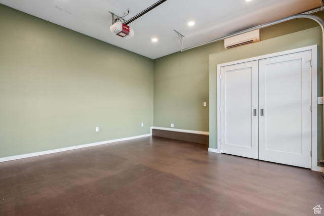 5419 S Kenwood Dr E, Salt Lake City, UT 84107 - unfurnished bedroom featuring an AC wall unit, concrete flooring, baseboards, recessed lighting, and a garage