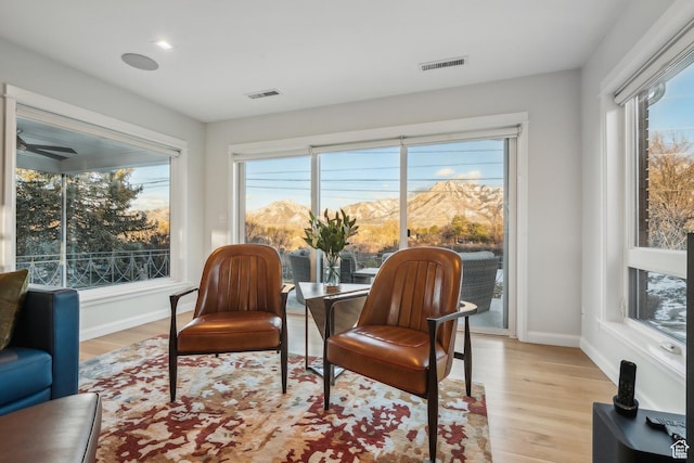 5419 S Kenwood Dr E, Salt Lake City, UT 84107 - living area featuring light wood-style floors, healthy amount of natural light, and baseboards
