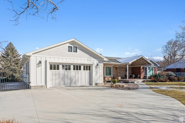 5419 S Kenwood Dr E, Salt Lake City, UT 84107 - ranch-style house featuring a porch, board and batten siding, driveway, and a garage