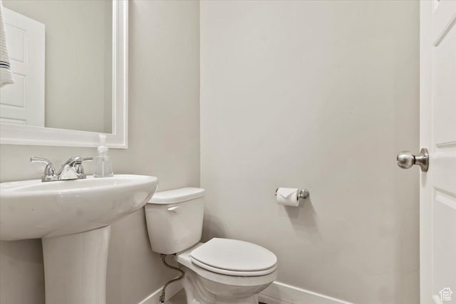 214 E Allegheny Pl S, Saratoga Springs, UT 84045 - bathroom with baseboards, toilet, and a sink