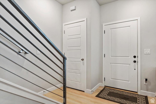 214 E Allegheny Pl S, Saratoga Springs, UT 84045 - entryway with light wood finished floors, baseboards, and stairs