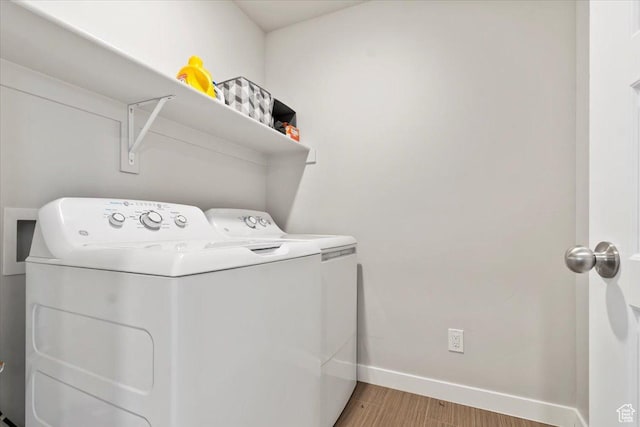 214 E Allegheny Pl S, Saratoga Springs, UT 84045 - washroom featuring washing machine and clothes dryer, baseboards, and light wood-type flooring