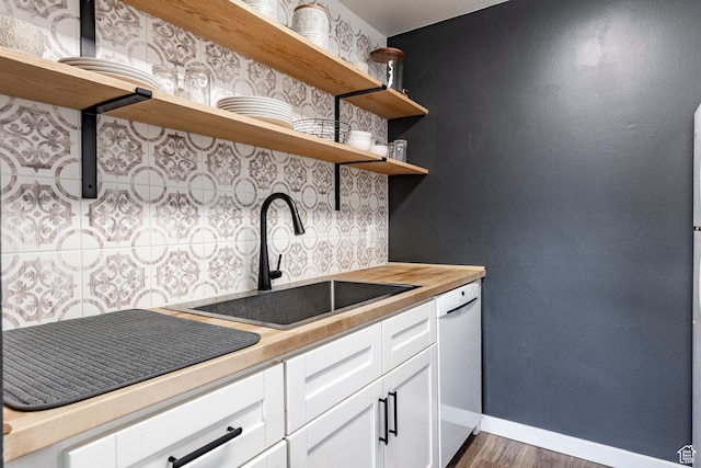 426 E Creekside Cir Unit E, Murray, UT 84107 - kitchen with open shelves, white dishwasher, a sink, baseboards, and dark wood finished floors