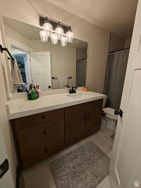 3469 S Bellrock Pl E Unit 5, South Salt Lake, UT 84115 - bathroom with vanity, toilet, and tile patterned floors