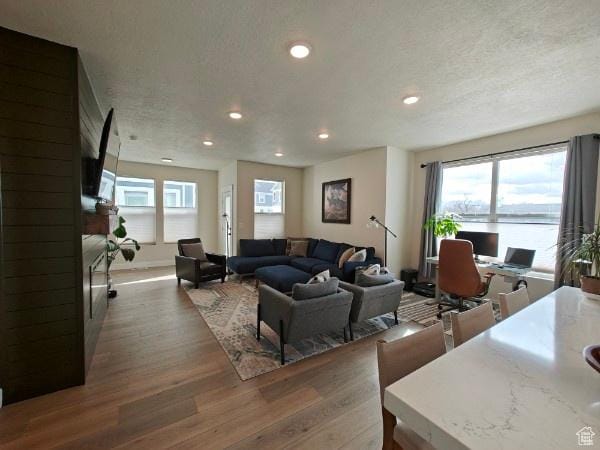 3469 S Bellrock Pl E Unit 5, South Salt Lake, UT 84115 - living room with dark wood-type flooring and a textured ceiling