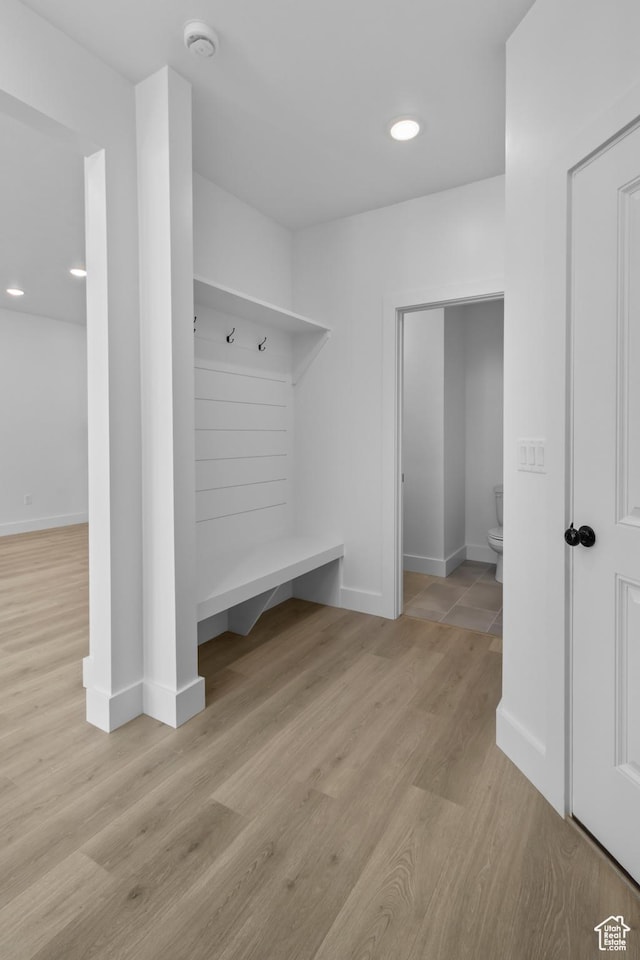 mudroom featuring recessed lighting, baseboards, and wood finished floors