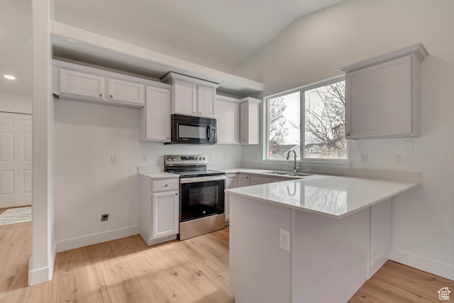 12972 S Cactus Berry Dr, Riverton, UT 84096 - kitchen featuring stainless steel electric range oven, a peninsula, light wood-style floors, black microwave, and a sink