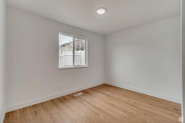 12972 S Cactus Berry Dr, Riverton, UT 84096 - unfurnished room featuring light wood-style flooring, visible vents, and baseboards