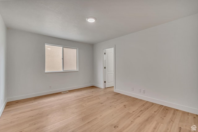 12972 S Cactus Berry Dr, Riverton, UT 84096 - spare room with baseboards, visible vents, and light wood-style floors