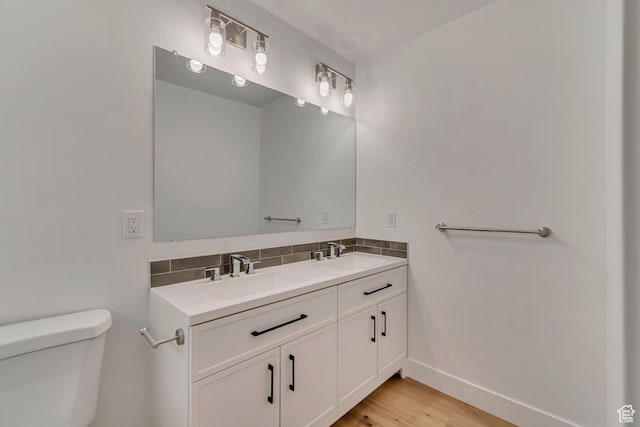 12972 S Cactus Berry Dr, Riverton, UT 84096 - bathroom featuring a sink, backsplash, toilet, and double vanity