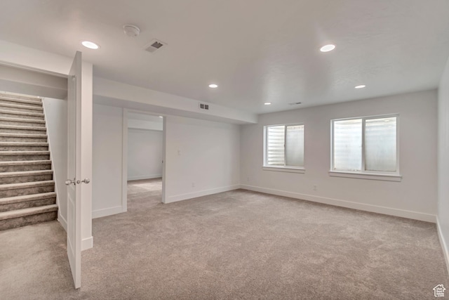 12972 S Cactus Berry Dr, Riverton, UT 84096 - spare room featuring light carpet, stairway, baseboards, and visible vents