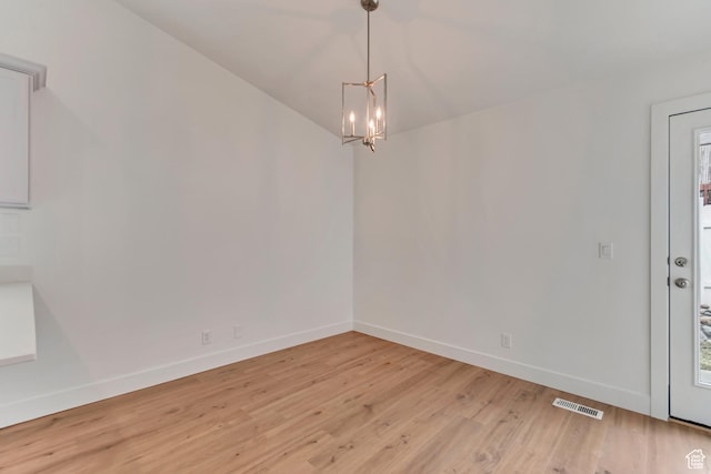 12972 S Cactus Berry Dr, Riverton, UT 84096 - unfurnished dining area with light wood-type flooring, baseboards, visible vents, and a chandelier