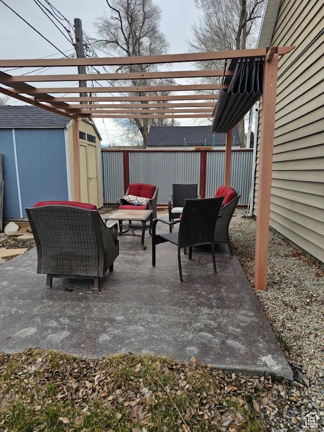 view of patio / terrace featuring a storage shed, an outdoor hangout area, an outdoor structure, fence, and a pergola