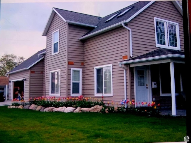 exterior space with a garage and a yard