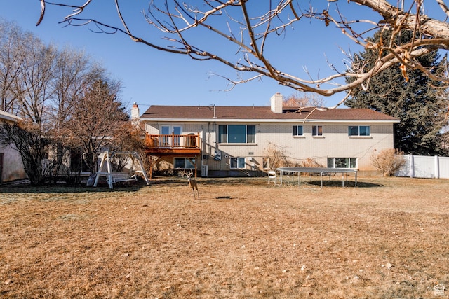 1105 S 500 W, Vernal, UT 84078 - rear view of property with a trampoline, a yard, and a deck