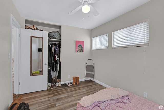 4868 S Ridgeline Dr, Washington Terrace, UT 84405 - bedroom featuring ceiling fan, a closet, and wood-type flooring