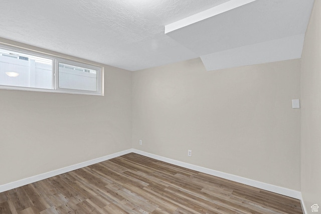 4868 S Ridgeline Dr, Washington Terrace, UT 84405 - unfurnished room with hardwood / wood-style flooring and a textured ceiling