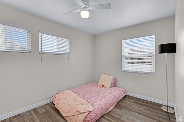 4868 S Ridgeline Dr, Washington Terrace, UT 84405 - bedroom with multiple windows, dark wood-type flooring, and ceiling fan