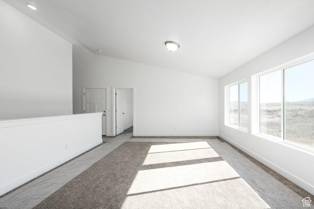 1152 W High Plains Dr Unit 612, Grantsville, UT 84029 - carpeted empty room featuring baseboards and vaulted ceiling