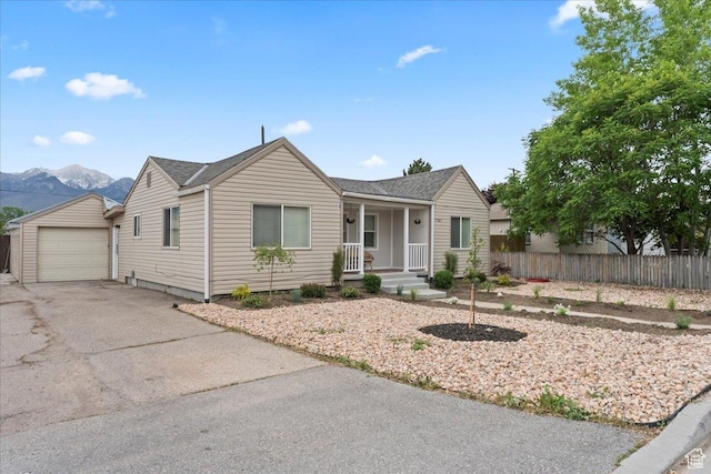 7581 S Birch St, Midvale, UT 84047 - ranch-style house featuring covered porch, driveway, a garage, and an outdoor structure