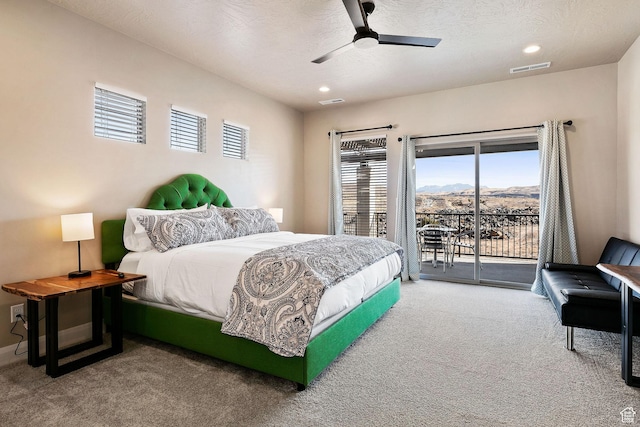 334 N 2020 W, Hurricane, UT 84737 - carpeted bedroom featuring a textured ceiling, ceiling fan, access to outside, and a mountain view
