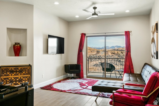 334 N 2020 W, Hurricane, UT 84737 - living room featuring ceiling fan, light hardwood / wood-style floors, and a textured ceiling