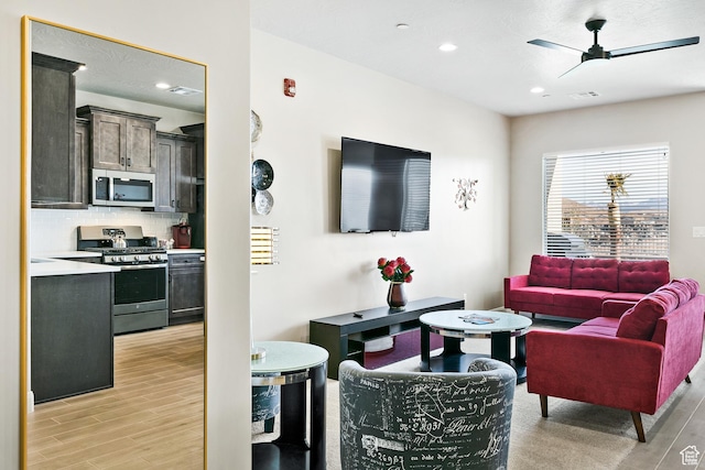 334 N 2020 W, Hurricane, UT 84737 - living room featuring light wood-type flooring and ceiling fan