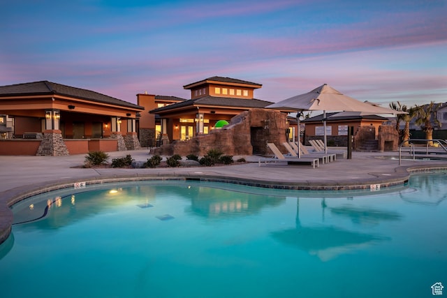 334 N 2020 W, Hurricane, UT 84737 - pool at dusk with exterior bar and a patio area