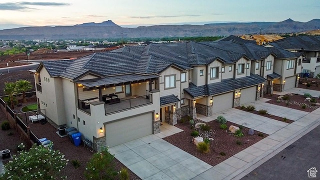 334 N 2020 W, Hurricane, UT 84737 - view of front of house with a mountain view, a garage, and cooling unit