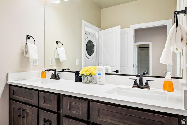 334 N 2020 W, Hurricane, UT 84737 - bathroom with stacked washer and clothes dryer and vanity