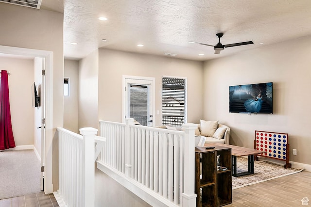 334 N 2020 W, Hurricane, UT 84737 - living room with a textured ceiling, ceiling fan, and light hardwood / wood-style floors