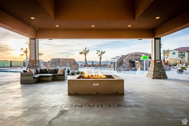 334 N 2020 W, Hurricane, UT 84737 - patio terrace at dusk featuring an outdoor living space with a fire pit
