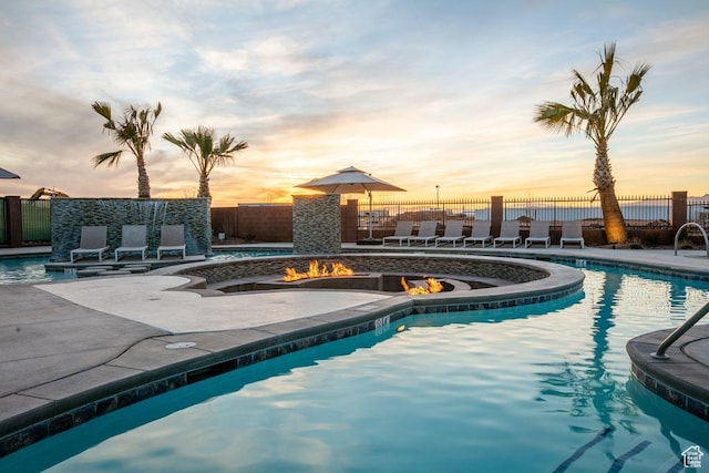334 N 2020 W, Hurricane, UT 84737 - pool at dusk with a patio and an outdoor fire pit