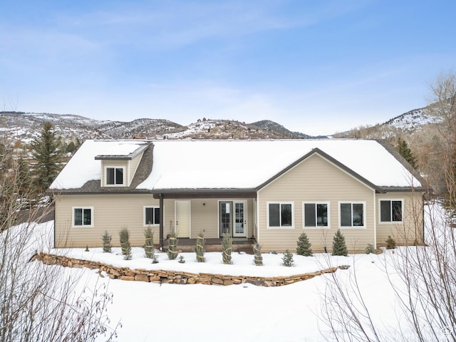 2326 Country Rd, Kamas, UT 84036 - snow covered house featuring covered porch and a mountain view