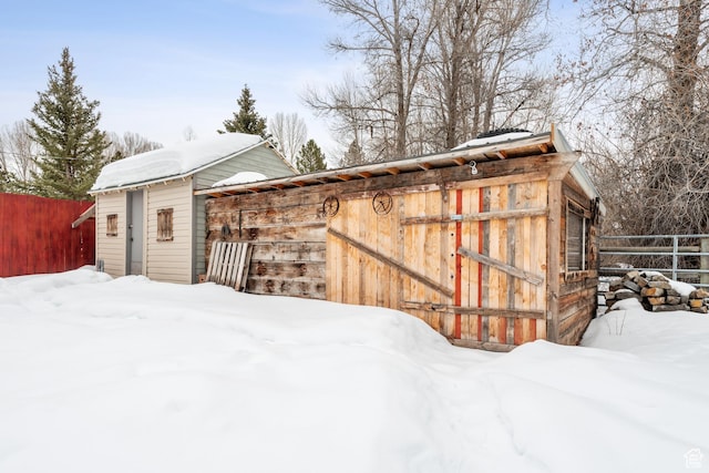 2326 Country Rd, Kamas, UT 84036 - snow covered structure featuring fence and an outdoor structure