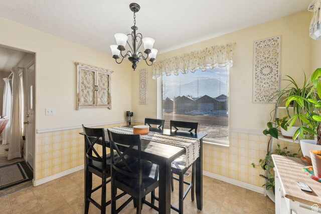 dining space featuring a notable chandelier