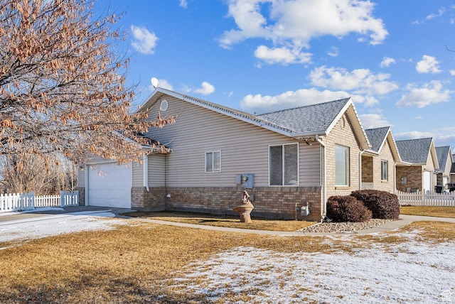 view of snow covered exterior with a garage