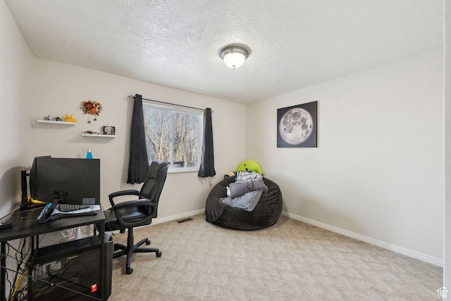 carpeted office with a textured ceiling