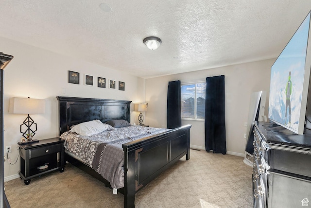 carpeted bedroom featuring a textured ceiling