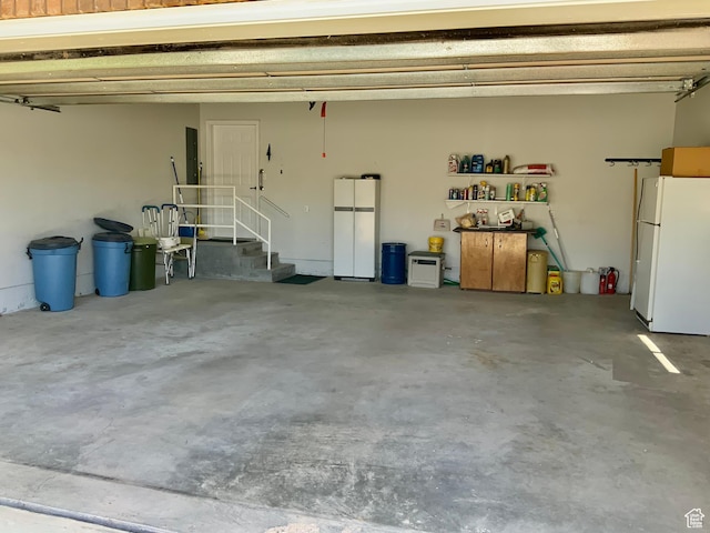 garage with white fridge