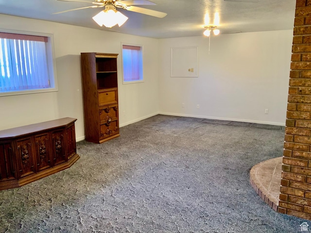 unfurnished bedroom with ceiling fan and carpet floors