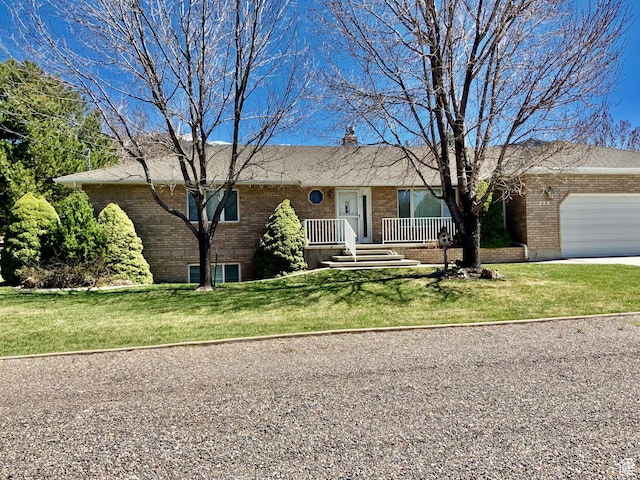 ranch-style home with a front yard and a garage