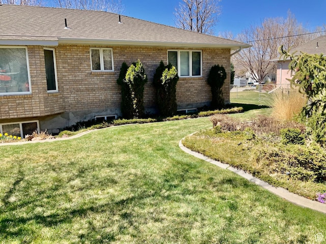view of home's exterior featuring a lawn