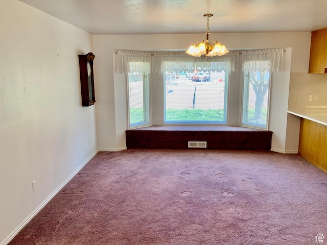 unfurnished dining area with carpet flooring and a notable chandelier