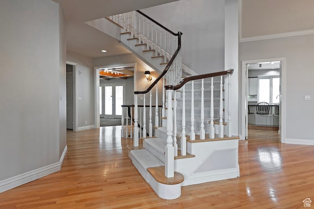 5845 Kerry Cir, Murray, UT 84107 - staircase with a high ceiling, ornamental molding, and hardwood / wood-style floors