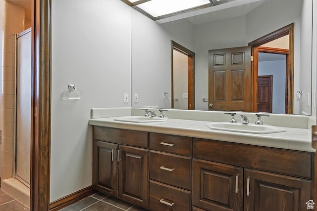 5845 Kerry Cir, Murray, UT 84107 - bathroom featuring tile patterned floors, vanity, and a shower with door