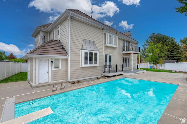 5845 Kerry Cir, Murray, UT 84107 - rear view of property featuring a swimming pool side deck, a patio, and a balcony